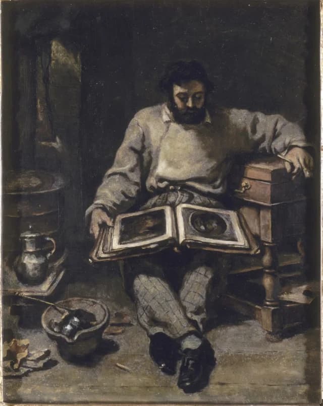 Marc Trapadoux che esamina un libro di stampe
