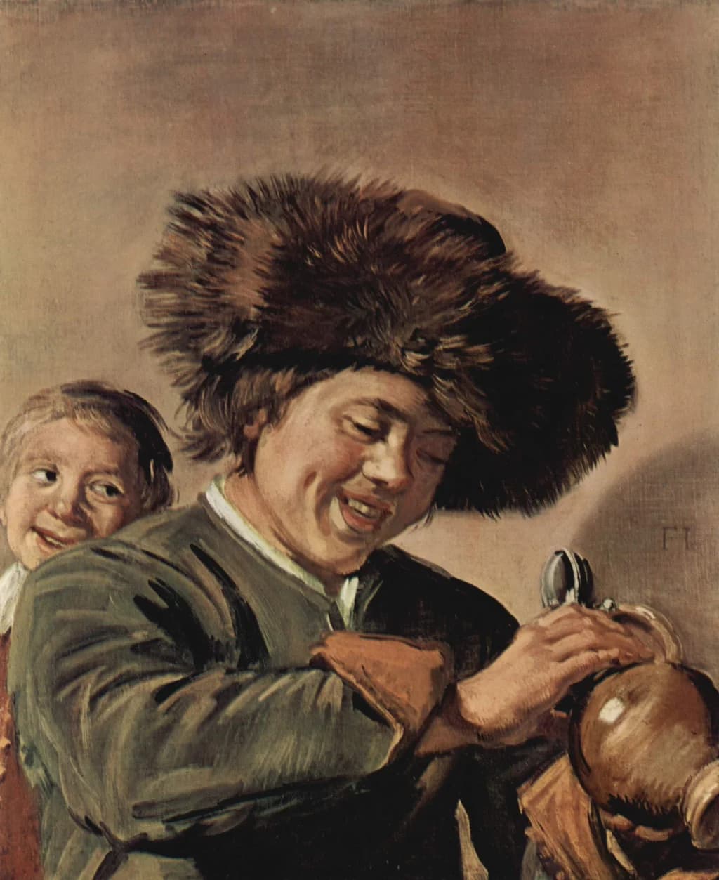 Two laughing boys with mug of beer