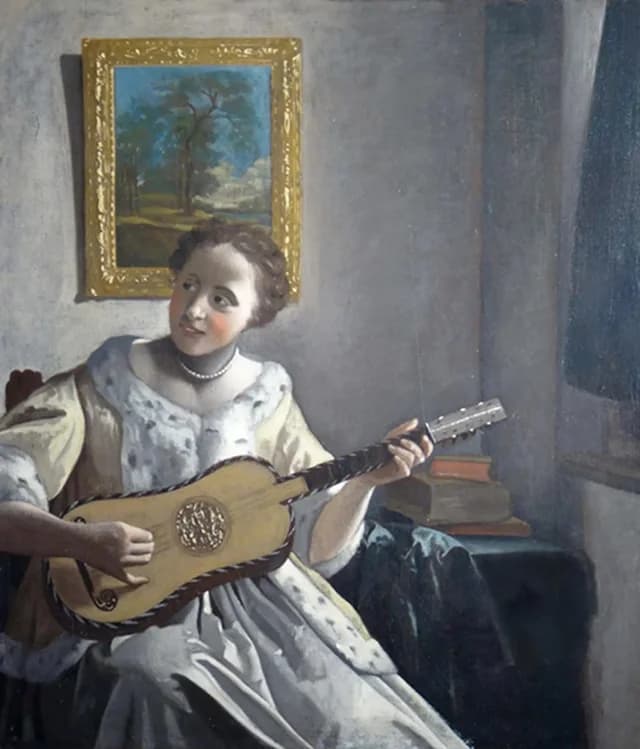 Una dama che suona la chitarra