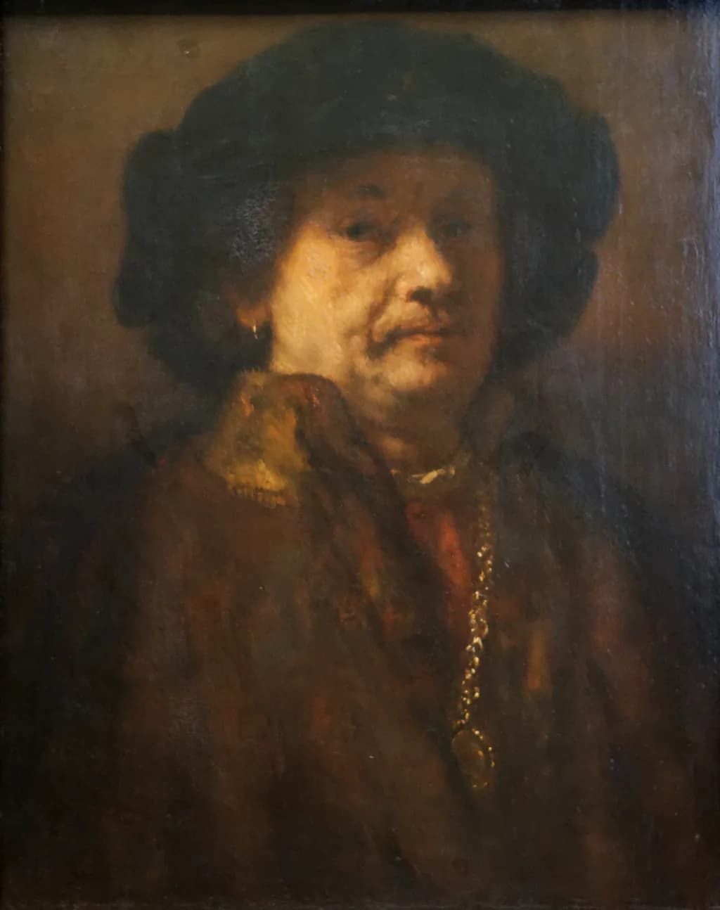 Self-portrait in a fur coat with gold chain and earring