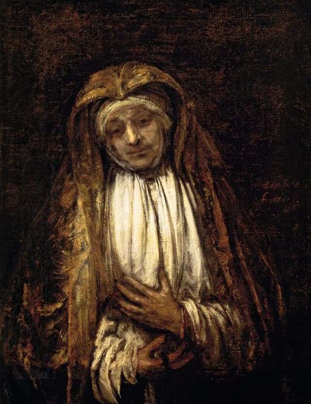 Elderly woman with a rosary