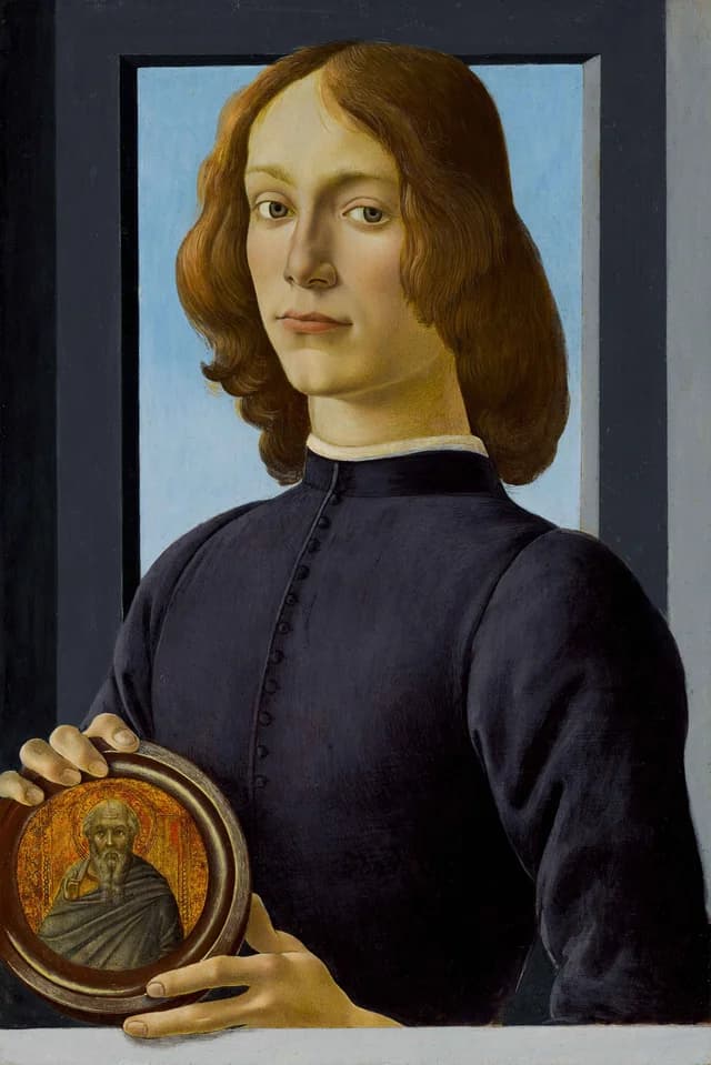 Young Man Holding a Roundel
