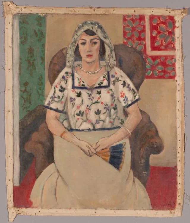 Woman sitting in an armchair