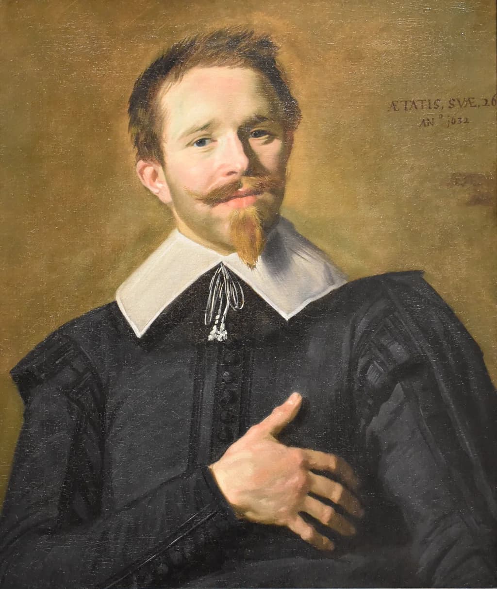 Portrait of a man with his hand on his heart