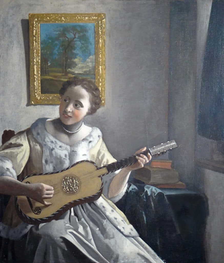A Lady Playing the Guitar
